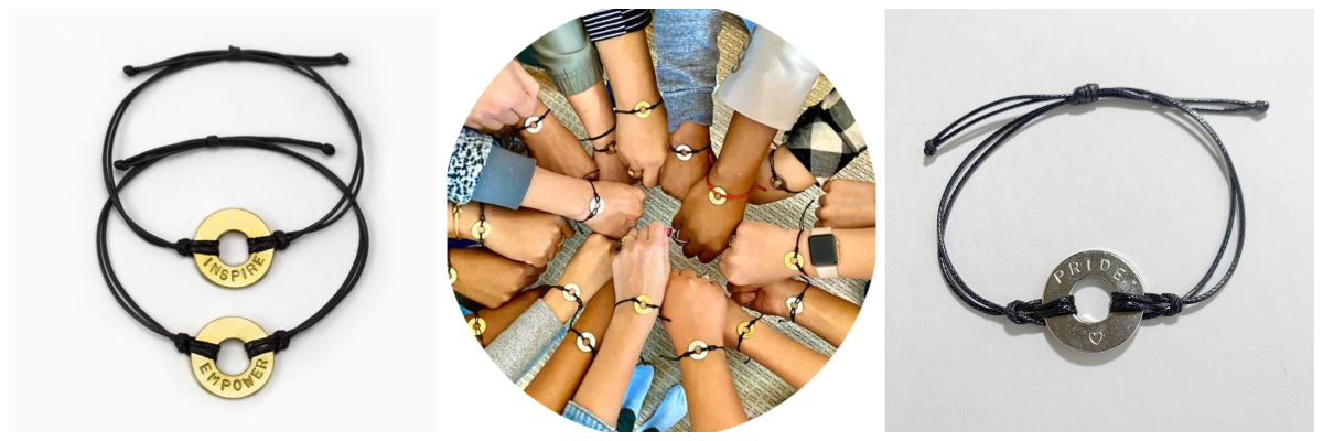 Three images in collage on left: 2 black bracelets with gold rings in center of bracelet. One ring says inspire and the other empower. In the center: several hands wearing bracelets similar to first and last picture. on left: black bracelet with a silver ring in the center that says pride and has a heart.