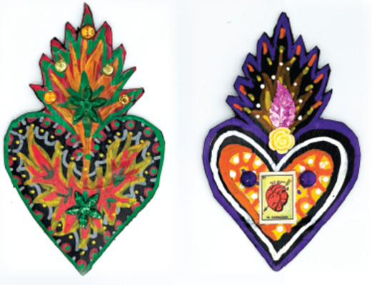 two metal hearts with flames decorated with paint and appliques