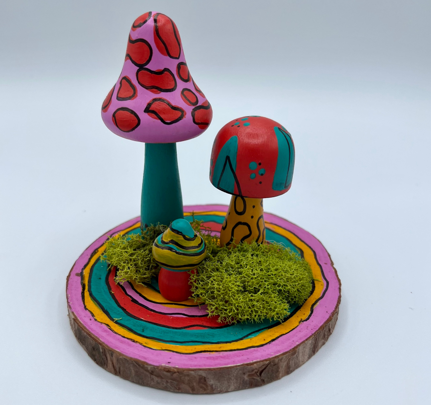 Painted wood slice with moss and two painted wood mushrooms