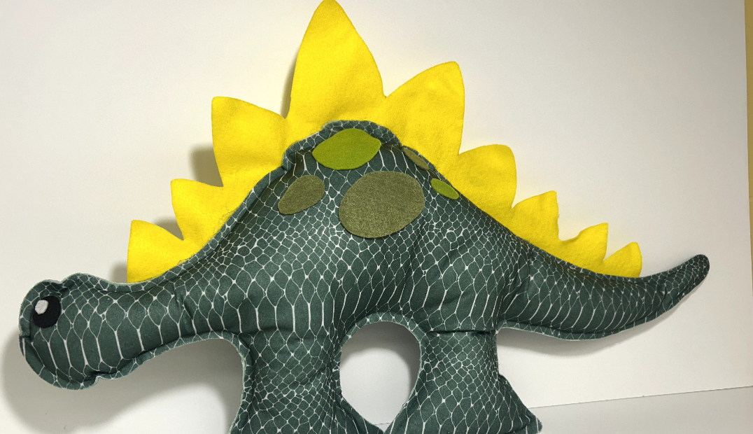 Green felt dinosaur stuffed animal