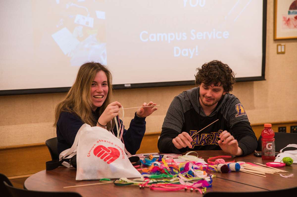Students making crafts during campus service day