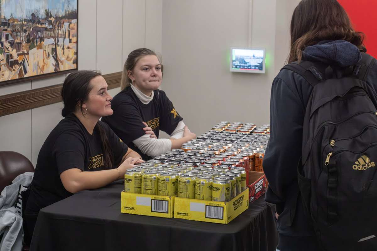 Student ambassadors help distribute Rock Star Energy Drinks at an ISU AfterDark event.